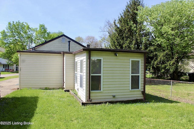 3023 Saint Dennis Ave, Louisville, KY 40216 - back of house with fence and a lawn