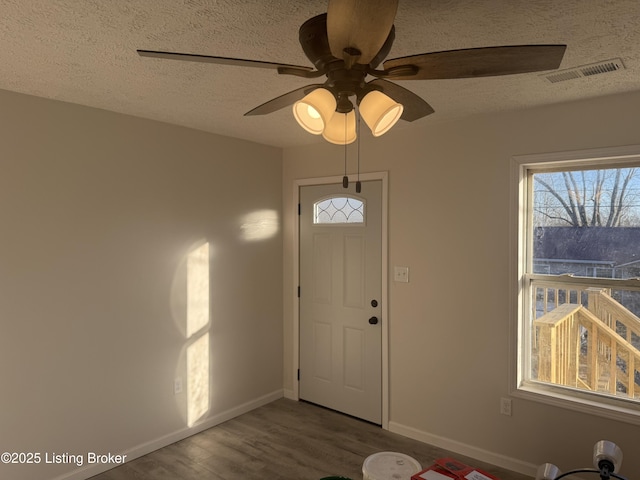 525 Leavette Ave, Leitchfield, KY 42754 - entryway with a textured ceiling, wood finished floors, baseboards, and ceiling fan