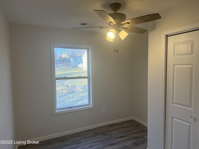 525 Leavette Ave, Leitchfield, KY 42754 - spare room featuring dark wood finished floors, ceiling fan, and baseboards