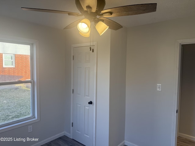 525 Leavette Ave, Leitchfield, KY 42754 - spare room featuring ceiling fan, baseboards, and dark wood-style floors
