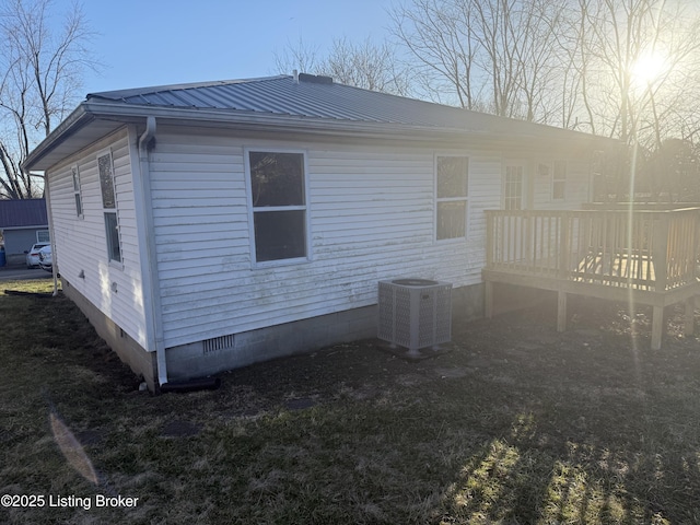 525 Leavette Ave, Leitchfield, KY 42754 - view of home's exterior with central AC, crawl space, metal roof, and a wooden deck