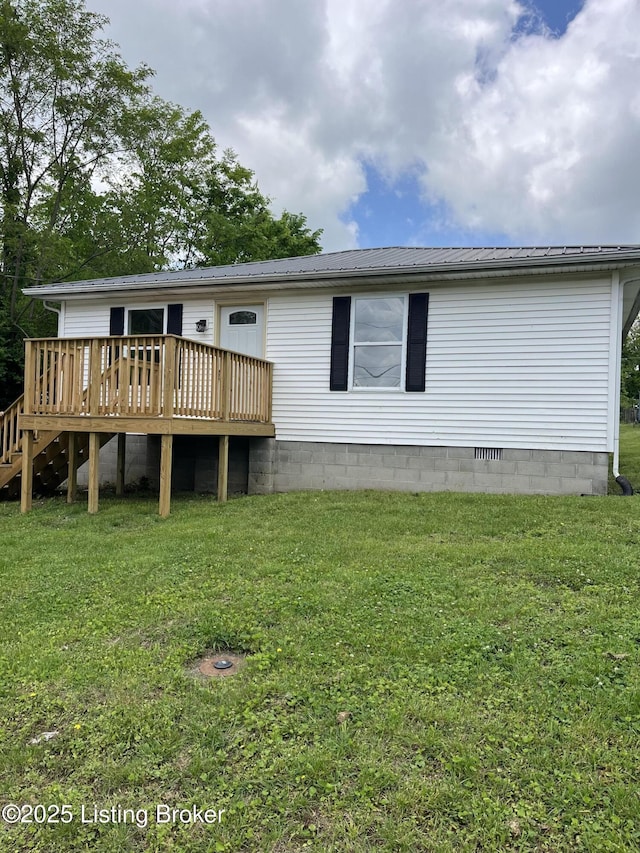 525 Leavette Ave, Leitchfield, KY 42754 - rear view of property featuring a wooden deck, metal roof, a lawn, and crawl space