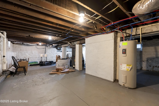 unfinished below grade area featuring water heater