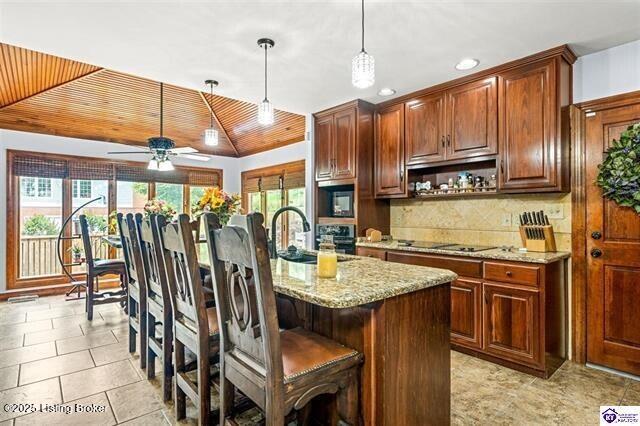 3507 Bridgegate Ct, Louisville, KY 40272 - kitchen with a sink, black electric stovetop, a ceiling fan, decorative light fixtures, and backsplash
