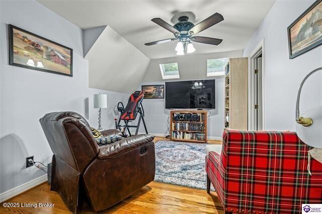 3507 Bridgegate Ct, Louisville, KY 40272 - living area with wood finished floors, ceiling fan, a skylight, and baseboards