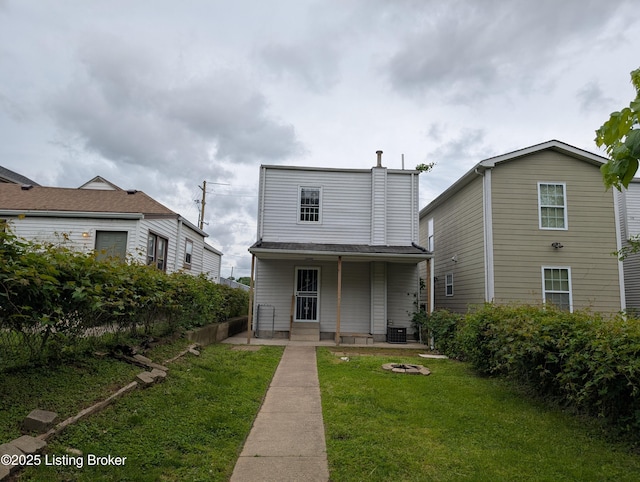 511 Marret Ave, Louisville, KY 40208 - view of front of property with covered porch, a front yard, and central AC unit