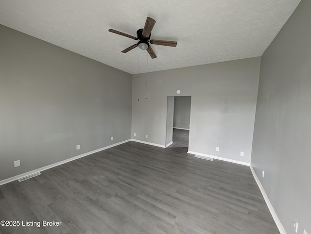 511 Marret Ave, Louisville, KY 40208 - empty room with a ceiling fan, a textured ceiling, baseboards, and dark wood-type flooring