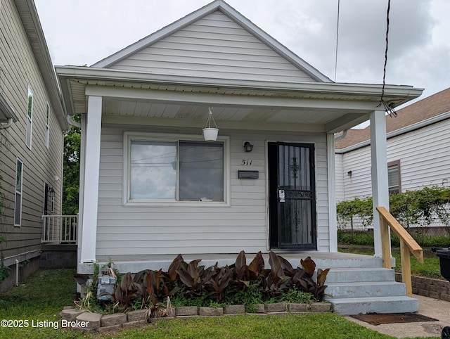 511 Marret Ave, Louisville, KY 40208 - shotgun-style home with a porch