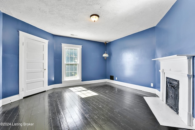 1836 Ellis Rd, Eminence, KY 40019 - unfurnished living room with wood-type flooring, baseboards, a fireplace with flush hearth, and a textured ceiling