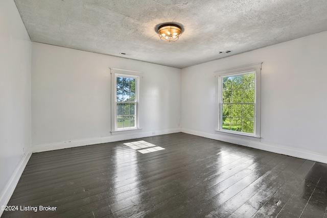 1836 Ellis Rd, Eminence, KY 40019 - unfurnished room featuring healthy amount of natural light, hardwood / wood-style floors, baseboards, and a textured ceiling