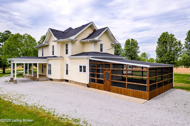 1836 Ellis Rd, Eminence, KY 40019 - view of front of home featuring a sunroom, a porch, driveway, and roof with shingles
