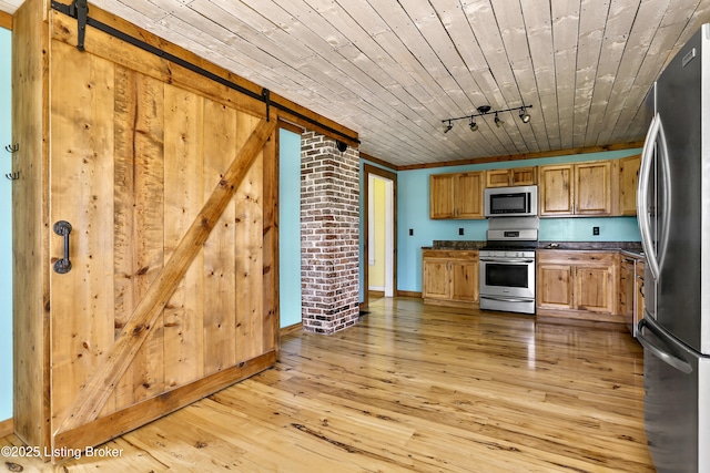 1836 Ellis Rd, Eminence, KY 40019 - kitchen featuring appliances with stainless steel finishes, a barn door, dark countertops, light wood-style flooring, and wood ceiling