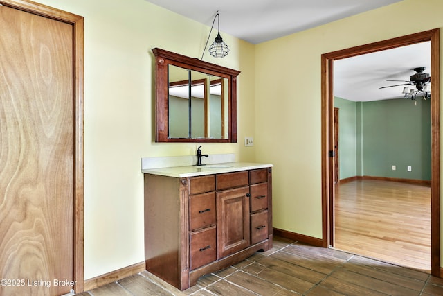 1836 Ellis Rd, Eminence, KY 40019 - bathroom with wood finish floors, a ceiling fan, baseboards, and vanity