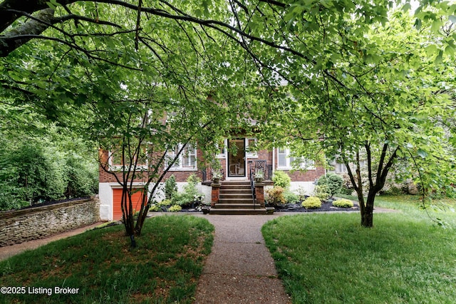 2104 Lauderdale Rd, Louisville, KY 40205 - obstructed view of property featuring brick siding and a garage