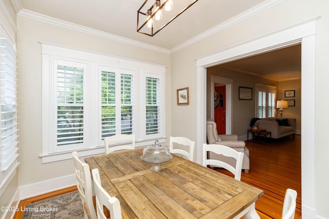 2104 Lauderdale Rd, Louisville, KY 40205 - dining area featuring ornamental molding, baseboards, and wood finished floors