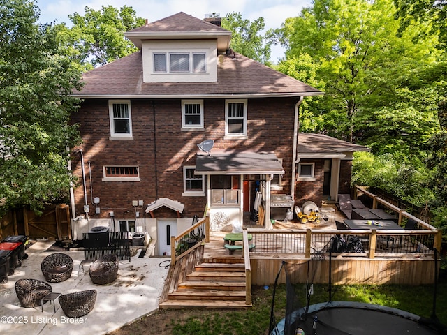 2104 Lauderdale Rd, Louisville, KY 40205 - rear view of house featuring brick siding, an outdoor fire pit, stairs, a deck, and roof with shingles
