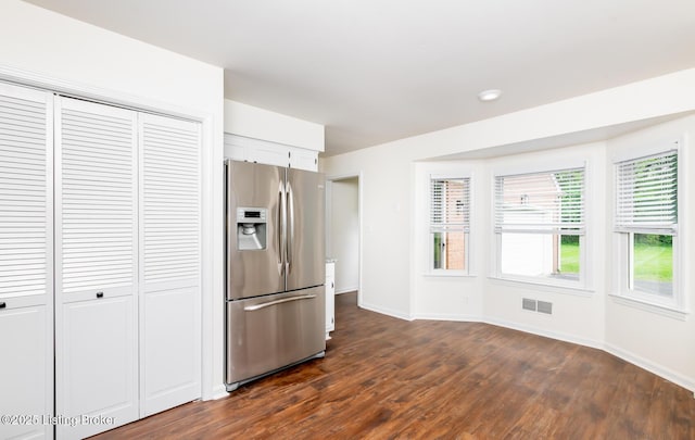 4002 Ciremos Ter, Louisville, KY 40241 - kitchen featuring stainless steel fridge, dark wood-style flooring, baseboards, and white cabinetry