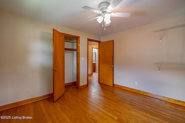 2213 Amboy Dr, Louisville, KY 40216 - unfurnished bedroom with baseboards, light wood-style flooring, ceiling fan, and a closet