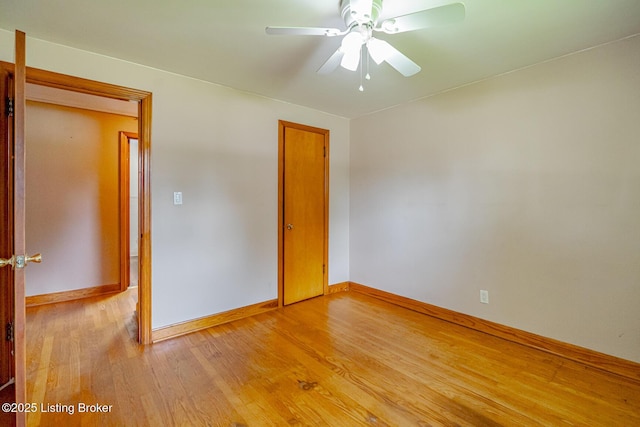 2213 Amboy Dr, Louisville, KY 40216 - empty room with light wood-style flooring, baseboards, and a ceiling fan