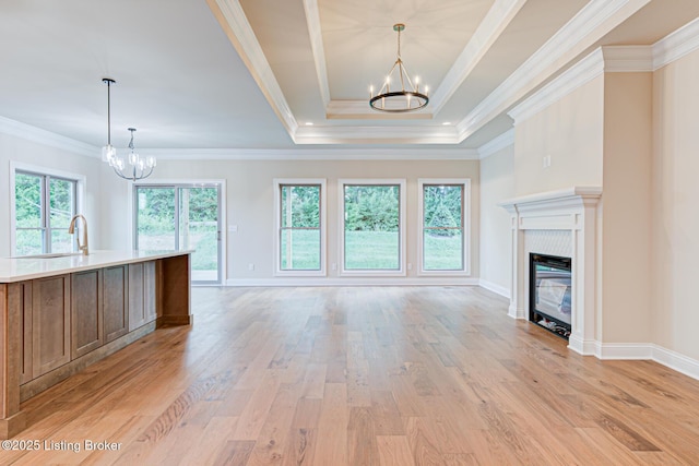 2003 Lakeview Villas Pl, Louisville, KY 40245 - unfurnished living room with a chandelier, a sink, light wood-style flooring, and crown molding