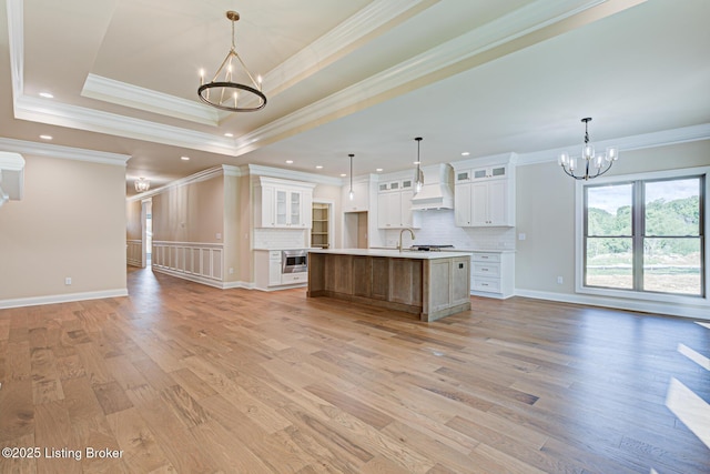 2003 Lakeview Villas Pl, Louisville, KY 40245 - kitchen with a chandelier, open floor plan, custom exhaust hood, light wood finished floors, and recessed lighting