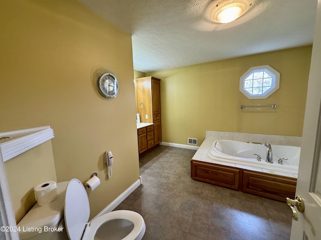 full bathroom with a textured ceiling, toilet, baseboards, visible vents, and a bath