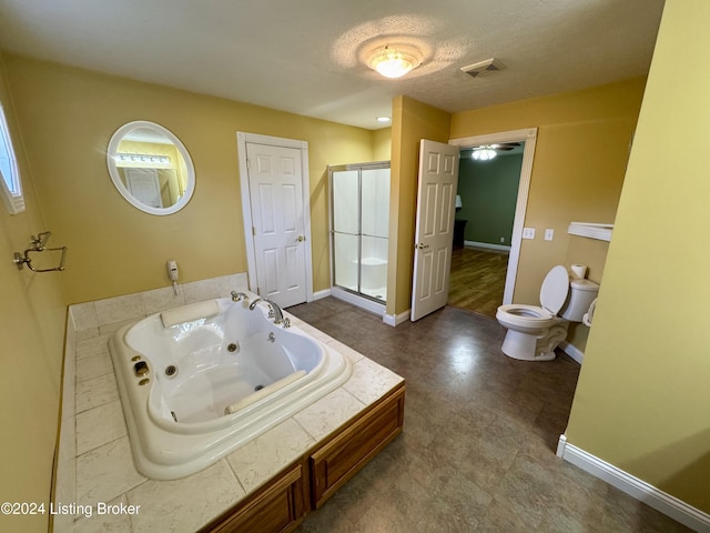 bathroom with a whirlpool tub, baseboards, toilet, a shower stall, and tile patterned floors