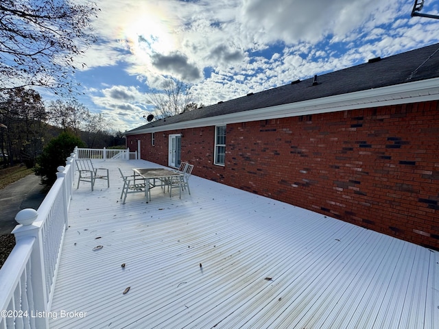 wooden deck with outdoor dining space