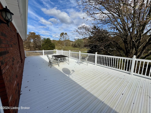 deck featuring outdoor dining area