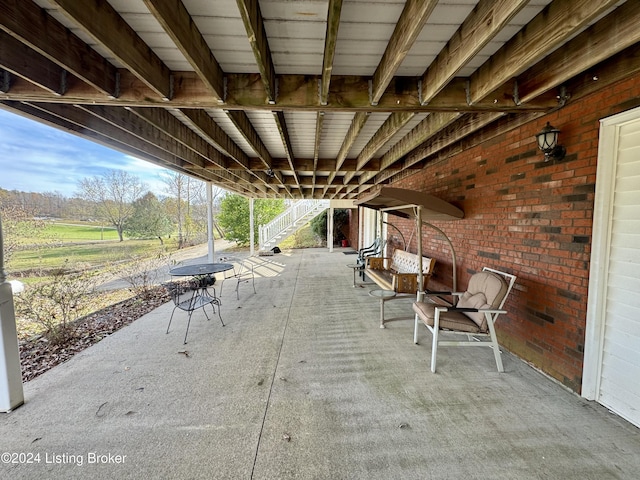 view of patio / terrace featuring stairs