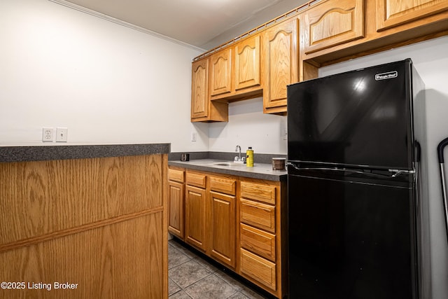 13216 Willow Forest Dr, Louisville, KY 40245 - kitchen with freestanding refrigerator, dark countertops, crown molding, tile patterned floors, and a sink