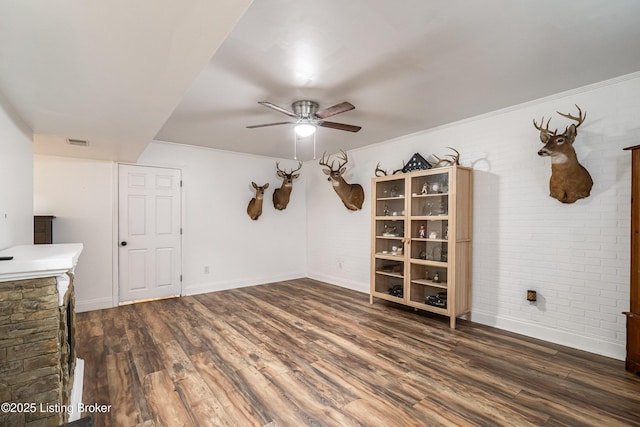 13216 Willow Forest Dr, Louisville, KY 40245 - spare room featuring wood finished floors, a ceiling fan, brick wall, and baseboards