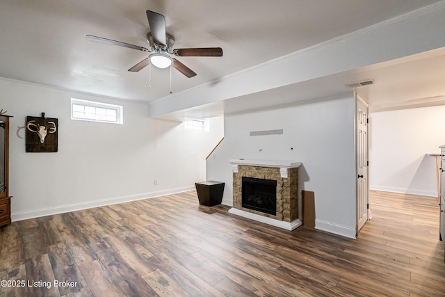 13216 Willow Forest Dr, Louisville, KY 40245 - unfurnished living room with ornamental molding, wood finished floors, ceiling fan, baseboards, and a stone fireplace
