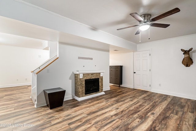 13216 Willow Forest Dr, Louisville, KY 40245 - unfurnished living room featuring a ceiling fan, wood finished floors, stairs, ornamental molding, and a fireplace