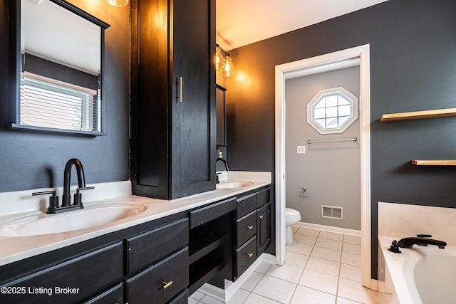 13216 Willow Forest Dr, Louisville, KY 40245 - bathroom featuring toilet, double vanity, healthy amount of natural light, and tile patterned flooring