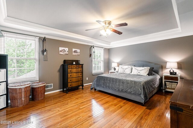 13216 Willow Forest Dr, Louisville, KY 40245 - bedroom featuring a tray ceiling, light wood finished floors, ornamental molding, baseboards, and ceiling fan