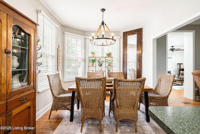 13216 Willow Forest Dr, Louisville, KY 40245 - dining room featuring a chandelier, light wood-type flooring, a ceiling fan, and baseboards