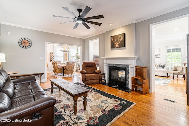 13216 Willow Forest Dr, Louisville, KY 40245 - living room featuring ceiling fan, light wood finished floors, a multi sided fireplace, crown molding, and baseboards