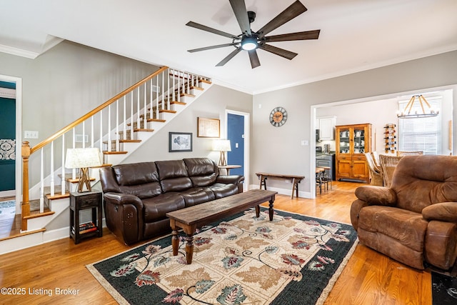13216 Willow Forest Dr, Louisville, KY 40245 - living room featuring stairs, light wood-type flooring, ornamental molding, a ceiling fan, and baseboards