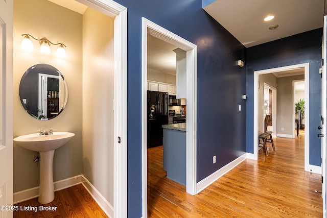 13216 Willow Forest Dr, Louisville, KY 40245 - hall with light wood-style floors, baseboards, and a sink
