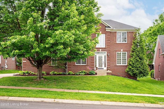 13216 Willow Forest Dr, Louisville, KY 40245 - view of front of home with a front yard and brick siding