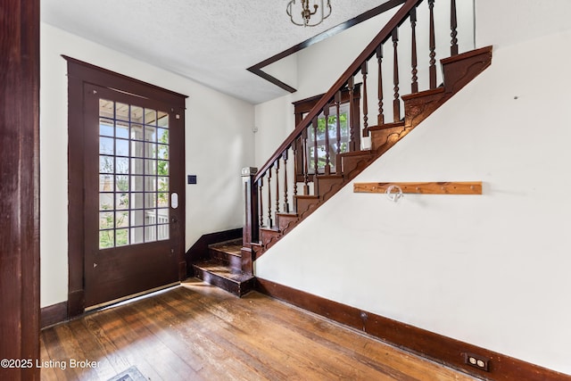 1412 Bluegrass Ave, Louisville, KY 40215 - foyer featuring a wealth of natural light, stairway, baseboards, and wood-type flooring
