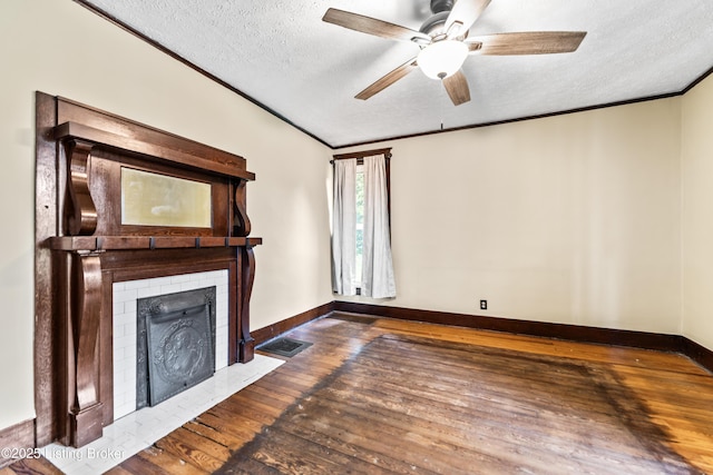 1412 Bluegrass Ave, Louisville, KY 40215 - unfurnished living room featuring hardwood / wood-style flooring, a textured ceiling, crown molding, ceiling fan, and baseboards