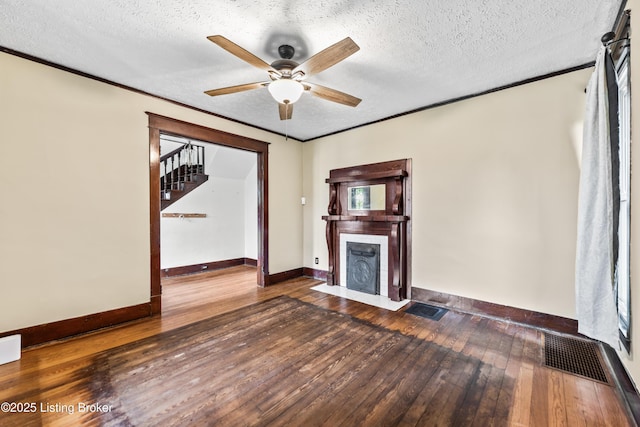1412 Bluegrass Ave, Louisville, KY 40215 - unfurnished living room with visible vents, ceiling fan, wood-type flooring, baseboards, and a fireplace with flush hearth