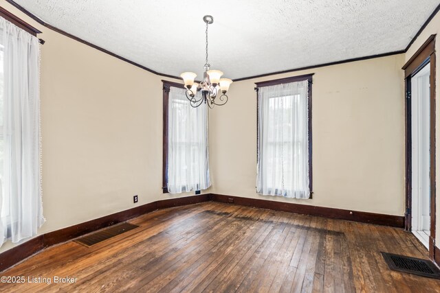 1412 Bluegrass Ave, Louisville, KY 40215 - spare room with crown molding, visible vents, wood-type flooring, and a notable chandelier