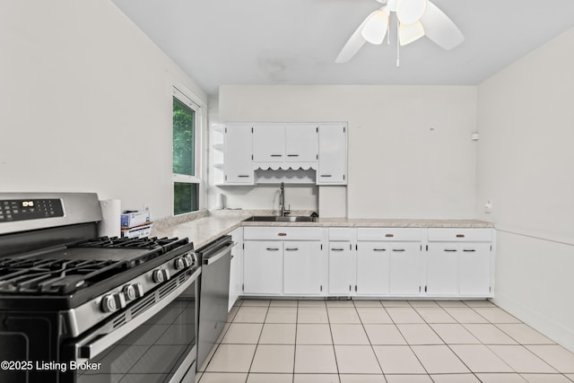 1412 Bluegrass Ave, Louisville, KY 40215 - kitchen with a sink, stainless steel appliances, white cabinetry, ceiling fan, and light countertops