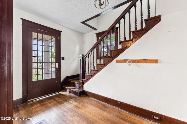 1412 Bluegrass Ave, Louisville, KY 40215 - foyer entrance with baseboards, stairway, a healthy amount of sunlight, and wood-type flooring