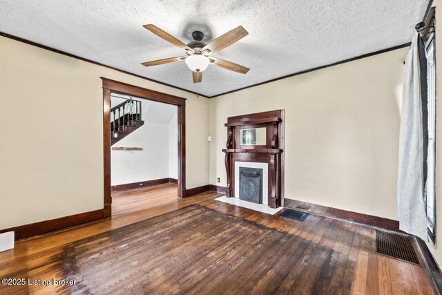 1412 Bluegrass Ave, Louisville, KY 40215 - unfurnished living room with a ceiling fan, baseboards, visible vents, a fireplace with flush hearth, and hardwood / wood-style floors