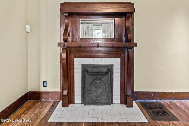 1412 Bluegrass Ave, Louisville, KY 40215 - interior details featuring baseboards, a fireplace with flush hearth, and wood finished floors