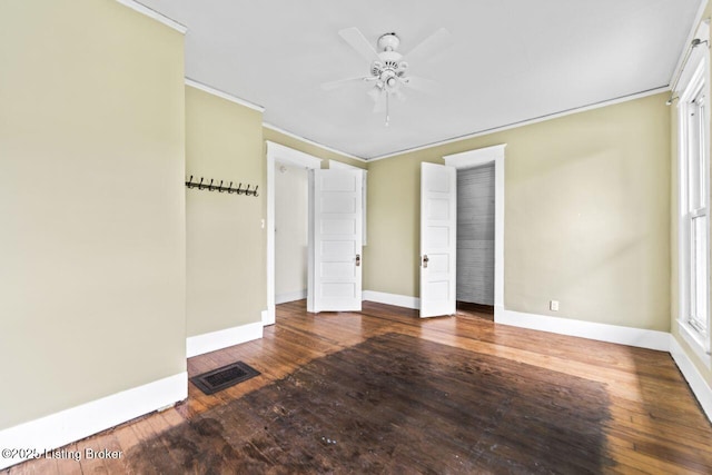 1412 Bluegrass Ave, Louisville, KY 40215 - unfurnished bedroom with a ceiling fan, baseboards, visible vents, crown molding, and hardwood / wood-style flooring